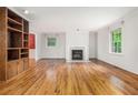 Bright, open living room with hardwood floors and a decorative fireplace feature at 5247 Yeager Rd, Douglasville, GA 30135