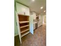 Spacious kitchen with a cabinet offering pull-out shelves and a view to the sink at 364 Stafford Sw St, Marietta, GA 30064