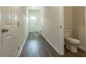 Inviting entryway featuring wood floors and a convenient half bathroom at 2804 Georgia Aster Way Nw, Atlanta, GA 30318
