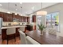 Open concept kitchen with stainless steel appliances, granite countertops, and wooden cabinets at 2808 Broughton Se Ln, Atlanta, GA 30339