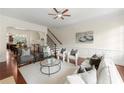 Inviting living room with hardwood floors, wainscoting and seamless flow to dining area at 2808 Broughton Se Ln, Atlanta, GA 30339