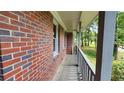 View of the front porch showing brick detail and railing at 766 Virginia Cir, Forest Park, GA 30297
