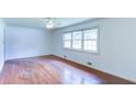 Bedroom with hardwood floors, a ceiling fan, and an abundance of natural light at 256 Indian Trl, Marietta, GA 30068
