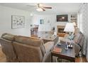 Inviting living room with a cozy fireplace, plush seating, and open floor plan at 27 Ansley Nw Way, Cartersville, GA 30121