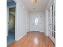 Welcoming foyer features hardwood floors, white trim, and ample natural light at 6328 Wellington Ct, Douglasville, GA 30134