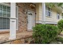 Close-up of the front door and porch featuring brick accents, stone details, and charming landscaping at 2510 Brentwood Ct, Decatur, GA 30032