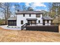 The rear exterior showcases a large deck, a screened porch, and a well-maintained yard at 260 Sandy Lake Cir, Fayetteville, GA 30214