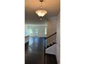 Inviting foyer with hardwood floors and staircase leading to the upper level at 136 Paulownia Cir, Mcdonough, GA 30253
