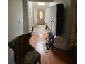 View of an entryway featuring a wooden door and floors at 5390 Regency Lake Court, Sugar Hill, GA 30518