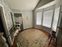 Bright living room with hardwood floors, white trim, and ample natural light at 5390 Regency Lake Court, Sugar Hill, GA 30518