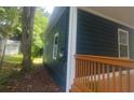 Side exterior showcasing the house siding and window details at 1321 Bridges Sw Ave, Atlanta, GA 30310