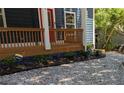 Charming front porch featuring fresh gravel and manicured landscaping at 1321 Bridges Sw Ave, Atlanta, GA 30310