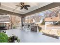 Spacious front porch with rocking chairs and a view of the quiet neighborhood street at 1450 Elizabeth Ln, Atlanta, GA 30344