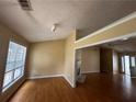 Bright living room with hardwood floors, large windows, and fireplace at 3718 Jackson Bluff Dr, Lawrenceville, GA 30044