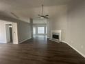 Bright living room featuring a marble fireplace, high ceilings, and modern ceiling fan at 3718 Jackson Bluff Dr, Lawrenceville, GA 30044