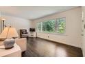 Sunlit living room with hardwood floors, large picture windows, and comfortable seating at 2205 Desmond Dr, Decatur, GA 30033