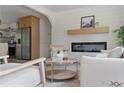 Bright living room with modern fireplace, wood floors, and open layout at 2244 Alpha Dr, Decatur, GA 30032