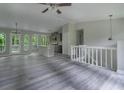 Spacious open floorplan with modern gray finishes, a kitchen island, and plentiful windows at 3066 Malvern Dr, Snellville, GA 30039