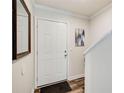 Bright entryway featuring a white door and hardwood floors at 3999 Bayside Cir, Doraville, GA 30340