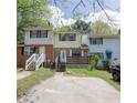 Attractive townhome showcasing a brick facade, front porch, and convenient parking at 6991 Flagstone Dr, Austell, GA 30168