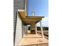Unfinished patio with a fireplace surrounded by beautiful nature at 214 Seward Street Unit #94, Conyers, GA 30094