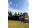 Klondike Reserve sign with stone base surrounded by manicured landscaping at 214 Seward Street Unit #94, Conyers, GA 30094