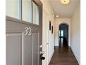 Elegant townhouse entryway with dark wood floors and modern finishes at 32 S Auburn Landing Pl, Auburn, GA 30011