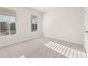 Clean and bright bedroom featuring two large windows and neutral carpeting at 4032 Trimrose Ct, Atlanta, GA 30349