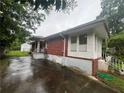 Brick home with a private driveway and small, fenced backyard at 301 Sisson Ne Ave, Atlanta, GA 30317