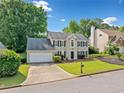 Traditional home boasting lush landscaping, mature trees, a two-car garage, and a serene neighborhood setting at 4780 Agate Dr, Johns Creek, GA 30022