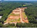 Expansive aerial of new community development in progress, showcasing layout of streets and future homesites at 15 Dartmoor Cir, Dallas, GA 30157