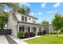 Beautiful home featuring a lush green lawn, a covered porch, and a private driveway at 313 Sisson Ne Ave, Atlanta, GA 30317