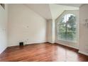 Bedroom features a large arched window, providing lots of natural light and a view of the outdoors at 3404 Bodiford Path Path, Powder Springs, GA 30127