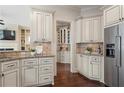 Traditional style kitchen featuring custom cabinets, granite countertops and stainless steel refrigerator at 4530 Westgate Dr, Cumming, GA 30040