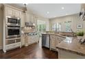 Spacious kitchen with stainless steel appliances and granite countertops at 4530 Westgate Dr, Cumming, GA 30040