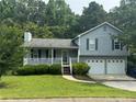 Charming two-story home with a well-manicured lawn and a two-car garage at 109 Ivy Crest Dr, Dallas, GA 30157