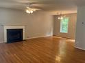 A spacious living room features a fireplace, hardwood floors, and plenty of natural light at 109 Ivy Crest Dr, Dallas, GA 30157