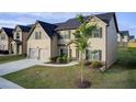 Beautiful two-story home with manicured lawn, two-car garage, and inviting curb appeal at 3746 Okefenokee Rdg, Loganville, GA 30052