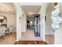 Inviting foyer showcasing arched doorways that lead to the formal dining and living room at 3746 Okefenokee Rdg, Loganville, GA 30052