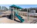 Community playground featuring a slide and climbing apparatus, perfect for families at 1311 Aura Ln, Lawrenceville, GA 30045