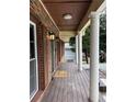 Covered front porch with elegant columns, offering a shaded entryway and classic curb appeal at 4807 Greenway Rd, Norcross, GA 30071