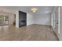Bright and airy living room with luxury vinyl floors and fireplace at 2265 Colony Dr, Canton, GA 30114