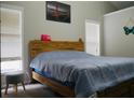 Bedroom featuring a large bed, natural lighting, and a modern headboard at 2350 Laurel Pointe Ln, Lawrenceville, GA 30043