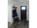 Welcoming entryway features stylish flooring, coat rack, and a modern front door at 2350 Laurel Pointe Ln, Lawrenceville, GA 30043