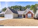 Charming single-Gathering home with a well-manicured front yard and attached two-car garage at 2350 Laurel Pointe Ln, Lawrenceville, GA 30043