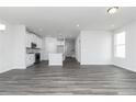 Spacious living room featuring a modern, open floor plan and sleek gray flooring at 3021 Cambridge Mill St, Acworth, GA 30102