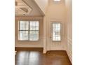 Inviting entryway with hardwood floors, a large window, and a bright white front door at 1205 Apple Blossom Dr, Cumming, GA 30041