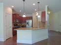 Kitchen with stainless steel appliances, granite countertops, and dark wood cabinets at 1205 Apple Blossom Dr, Cumming, GA 30041
