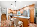 Eat-in kitchen featuring granite counters, stainless appliances, central island and terracotta tile floor at 2240 Murdock Rd, Marietta, GA 30062