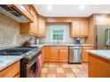 Bright, spacious kitchen with stainless appliances, tile backsplash and granite countertops at 2240 Murdock Rd, Marietta, GA 30062